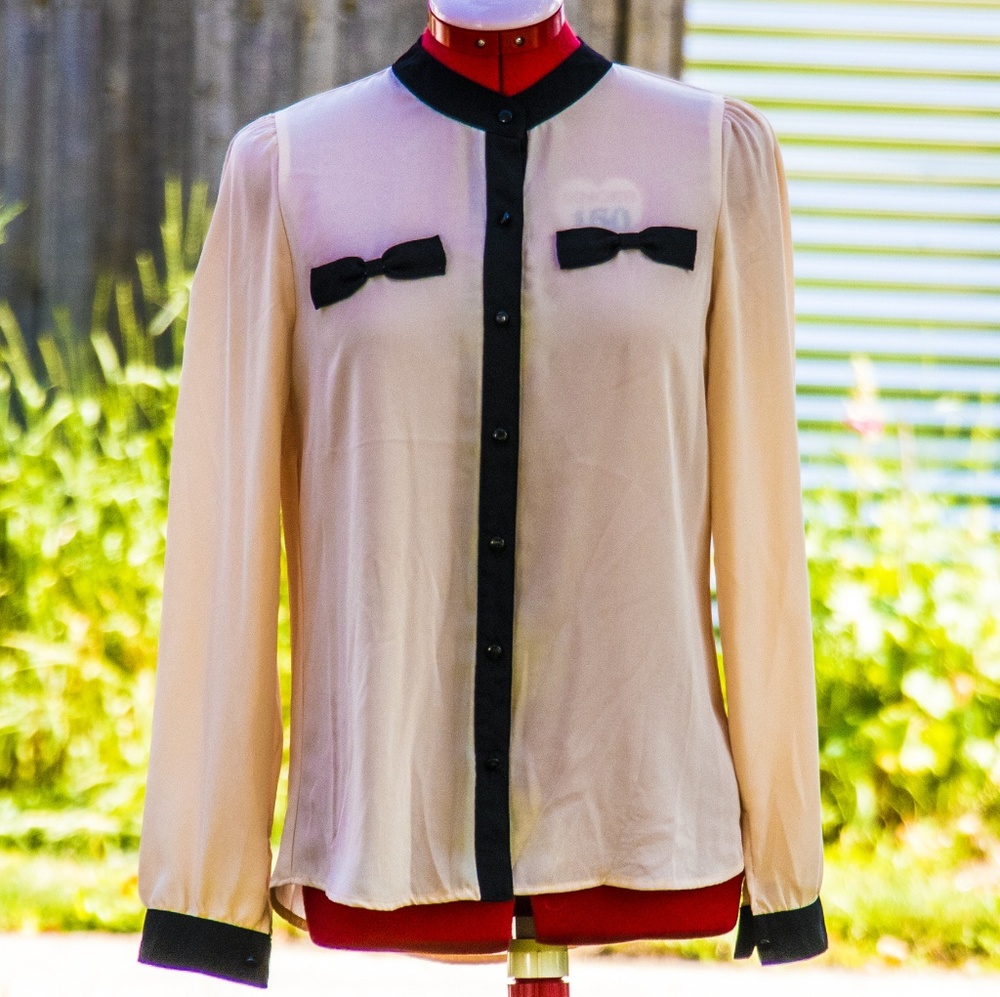 Pale pink blouse with bow detail